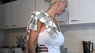 A Blonde With Glasses On Her Knees Nursing On A Dick